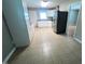 Open concept kitchen showcasing ample counter space and tiled floors at 727 Queens Ave, Dunn, NC 28334
