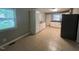 Open kitchen area featuring tile flooring, abundant cabinets, and natural light at 727 Queens Ave, Dunn, NC 28334