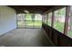 View of screened porch with access to the yard at 727 Queens Ave, Dunn, NC 28334