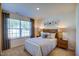 Cozy bedroom featuring a large window, plush carpeting, and tasteful decor at 7461 Michelle Rd, Rocky Mount, NC 27803