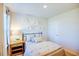 Inviting bedroom with a cozy bed, soft lighting, and stylish wall decor at 7461 Michelle Rd, Rocky Mount, NC 27803