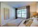 Serene bedroom with a large window, soft lighting, and comfortable bedding at 7461 Michelle Rd, Rocky Mount, NC 27803