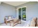 Cozy covered patio with comfortable seating, perfect for relaxing or entertaining outdoors at 7461 Michelle Rd, Rocky Mount, NC 27803