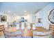 Open dining room with wooden table and seating adjacent to modern kitchen at 7461 Michelle Rd, Rocky Mount, NC 27803