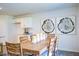 Cozy dining room with wood table, chairs, and decorative wall art at 7461 Michelle Rd, Rocky Mount, NC 27803