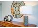 Close-up on bedroom dresser decor, a round mirror, and a decorative table lamp at 7461 Michelle Rd, Rocky Mount, NC 27803