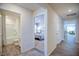 Inviting hallway leading to bathroom, bedroom, and main living area at 7461 Michelle Rd, Rocky Mount, NC 27803