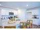 Bright kitchen features white cabinets, granite countertops, and a center island with bar stool seating at 7461 Michelle Rd, Rocky Mount, NC 27803
