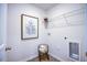 Laundry room with appliances hookups, wire shelving, and modern flooring at 7461 Michelle Rd, Rocky Mount, NC 27803