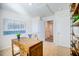 Home office with a wooden desk and open doorway to additional rooms at 7461 Michelle Rd, Rocky Mount, NC 27803