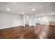 Unfinished basement featuring hardwood flooring, neutral paint, and recessed lighting throughout at 7808 Umstead Forest Dr, Raleigh, NC 27612