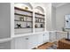 Custom built-in shelving with arched details, offering stylish storage in the home office space at 7808 Umstead Forest Dr, Raleigh, NC 27612