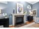 Elegant fireplace with stone surround and decorative mantle in a cozy living space at 7808 Umstead Forest Dr, Raleigh, NC 27612