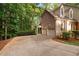 Attached two-car garage with a driveway, offering convenient parking and access to the home's side entrance at 7808 Umstead Forest Dr, Raleigh, NC 27612