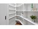 A walk-in pantry offers ample storage space with its numerous shelves, baskets, and containers at 7808 Umstead Forest Dr, Raleigh, NC 27612