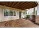 Spacious patio area with exposed wood ceiling and outdoor access creates a relaxing outdoor living space at 7808 Umstead Forest Dr, Raleigh, NC 27612