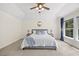 Primary bedroom with ceiling fan, lots of light, and luxury bedding at 8517 Evans Mill Pl, Raleigh, NC 27613