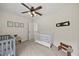 Bedroom with two baby beds and cute 'time out' stool at 8517 Evans Mill Pl, Raleigh, NC 27613