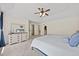 Primary bedroom with ceiling fan, lots of light, and luxury bedding at 8517 Evans Mill Pl, Raleigh, NC 27613