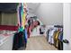 Walk-in closet with wire shelving and lots of hanging clothes at 8517 Evans Mill Pl, Raleigh, NC 27613