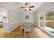 Charming dining room with hardwood floors, a ceiling fan, and natural light, perfect for Gathering gatherings at 8517 Evans Mill Pl, Raleigh, NC 27613