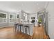 Bright kitchen features stainless steel appliances, granite counters, island, and a breakfast area at 8517 Evans Mill Pl, Raleigh, NC 27613