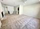 Bright bonus room with neutral carpet and upstairs hallway, perfect for entertaining at 8813 Moss Glen Dr, Raleigh, NC 27617