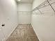 Walk-in closet with ample shelving, providing great storage and organization options at 8813 Moss Glen Dr, Raleigh, NC 27617