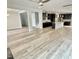Open-concept living area with hardwood floors, dark kitchen and large island, perfect for modern living at 8813 Moss Glen Dr, Raleigh, NC 27617