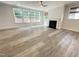 Bright living room features lots of natural light, a fireplace, and hardwood floors at 8813 Moss Glen Dr, Raleigh, NC 27617