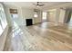 Bright living room offers hardwood floors, modern fireplace, and a ceiling fan at 8813 Moss Glen Dr, Raleigh, NC 27617