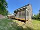 Beautiful home featuring a spacious screened porch with white railings and an adjacent wood deck at 8813 Moss Glen Dr, Raleigh, NC 27617