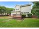 This home features a backyard with a lush lawn, wood deck, and privacy fence at 900 Borage Dr, Wake Forest, NC 27587