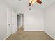 Bedroom with carpeted floors, neutral walls, a double-door closet, and easy access to the en suite bathroom at 900 Borage Dr, Wake Forest, NC 27587