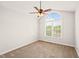 Bright bedroom featuring vaulted ceilings, a ceiling fan, carpet, and a window for natural light at 900 Borage Dr, Wake Forest, NC 27587