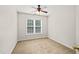 This bedroom offers neutral walls, carpet, and a ceiling fan for a modern yet cozy feel at 900 Borage Dr, Wake Forest, NC 27587