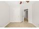 Bedroom with carpeted floors, neutral walls, and easy access to the en suite bathroom at 900 Borage Dr, Wake Forest, NC 27587