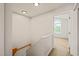 Second floor hallway leads to a bedroom with an arched window at 900 Borage Dr, Wake Forest, NC 27587