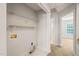 Upstairs laundry room features built-in shelving and easy access to the bedrooms at 900 Borage Dr, Wake Forest, NC 27587