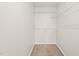 Spacious walk-in closet with shelving at 900 Borage Dr, Wake Forest, NC 27587