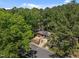The bird's eye perspective shows the property surrounded by lush trees and the neighborhood at 903 Da Vinci St, Durham, NC 27704