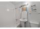 All-white bathroom with tub, shower, toilet, and sink at 903 Da Vinci St, Durham, NC 27704