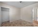 Bedroom showcases a standard light fixture and outdated flooring at 903 Da Vinci St, Durham, NC 27704