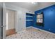 Bedroom with open doorway to a room with hardwood floors and built in shelves at 903 Da Vinci St, Durham, NC 27704
