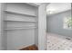 View of a closet with open shelving and hardwood floors at 903 Da Vinci St, Durham, NC 27704