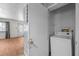 Small laundry room with a washer and older dryer at 903 Da Vinci St, Durham, NC 27704