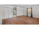 Bright living room with hardwood floors, a large closet, and ample natural light from the window at 903 Da Vinci St, Durham, NC 27704