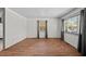 Bright living room with hardwood floors, and ample natural light from the large windows at 903 Da Vinci St, Durham, NC 27704