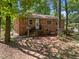 The rear exterior features a brick facade, visible windows, and a modest staircase leading to the entrance at 903 Da Vinci St, Durham, NC 27704