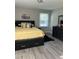 Cozy bedroom featuring a queen bed, dark furniture, and modern decor at 940 Pamela Ln, Rocky Mount, NC 27803